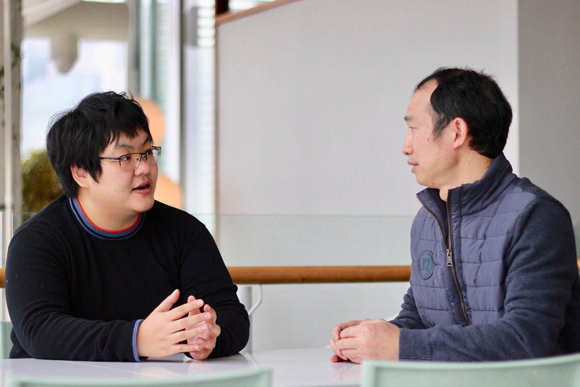Jing Hou (left) and Guihong Tan from the Andrews and Boone labs are uncovering how minute discrepancies between genomes translate to individual differences within a species