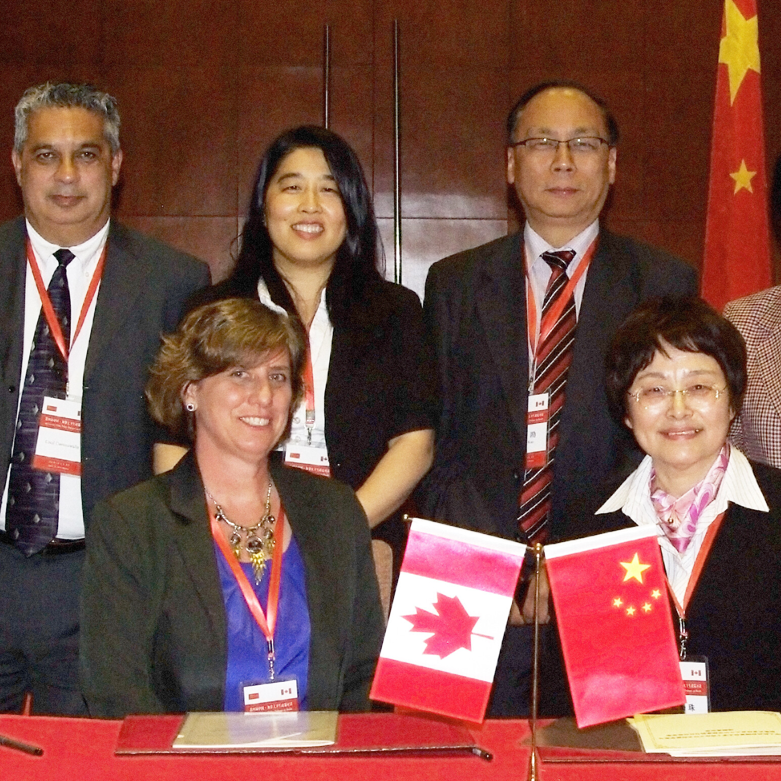 Professor Zhu Shanzhu, Dean of the Department of General Practice, Shanghai Medical College, Fudan University, signing the MOU with DFCM's Professor Cynthia Whitehead