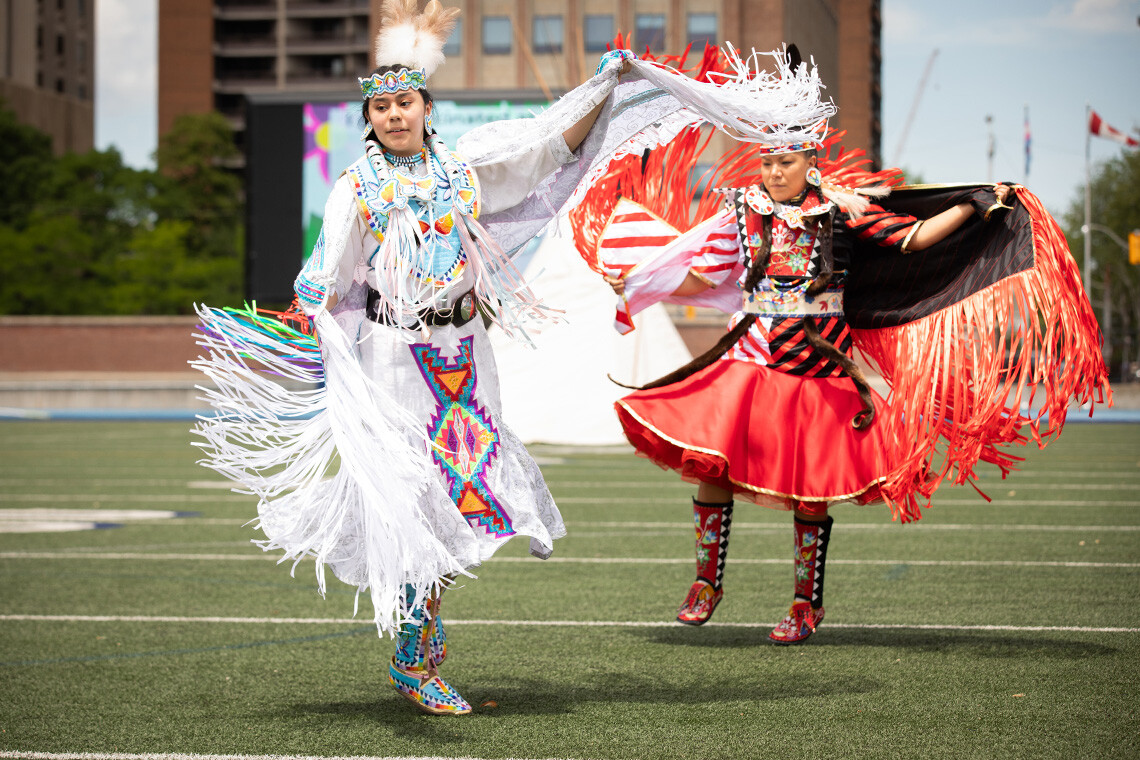 Alanna Pasche and Deanne Hupfield perform at an Indigenous vaccine clinic at U of T's Varsity Stadium